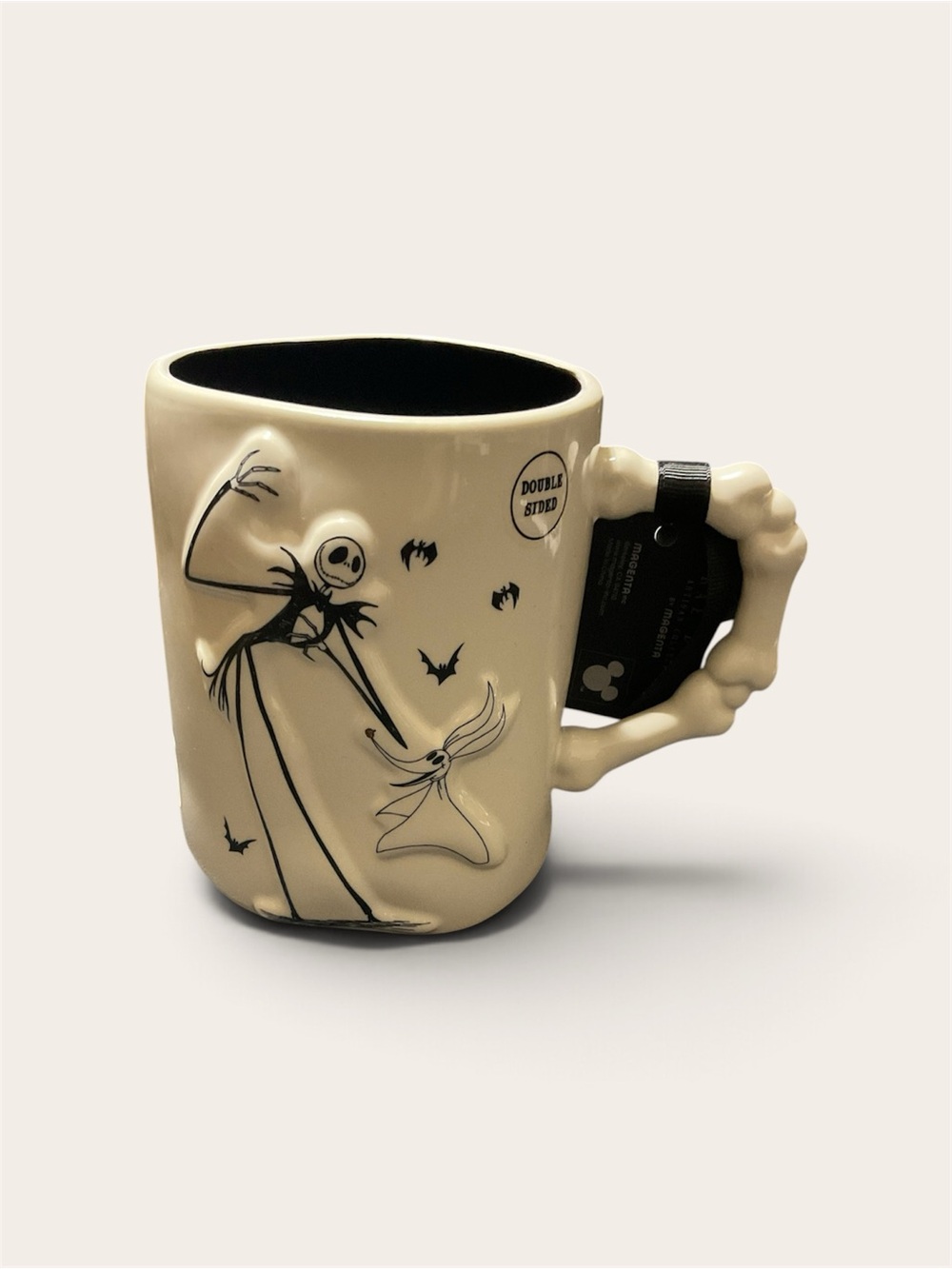 Celebrate Halloween with this Rae Dunn PLAY DEAD Ceramic Mug, featuring Jack Ske